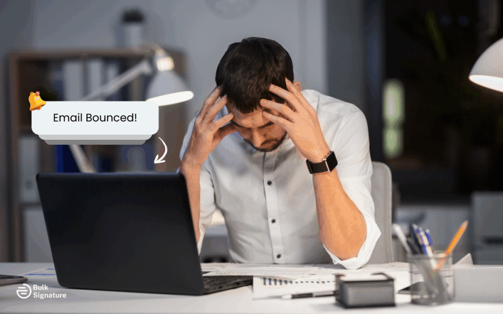 Conceptual stock photo of frustrated person looking at computer screen with "Email Bounced" alert